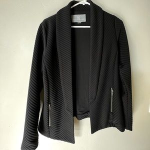 Soft work jacket w/ zipper pockets. Runs a little larger & never worn with tag.